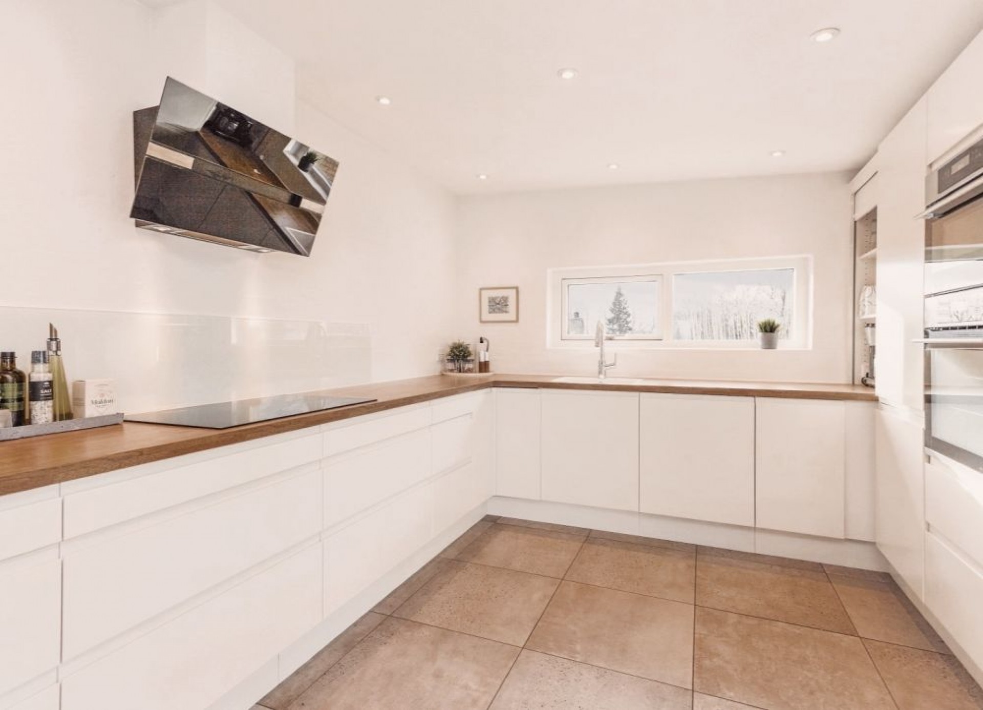 Køkken på Solbakkevej Renoveret køkken med brune klinker